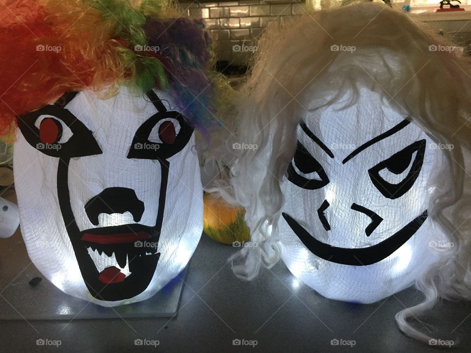 DIY Halloween crafts made from milk jugs. Battery operated light strings were fed into the bottles and the jugheads were placed on the steps to light the way.