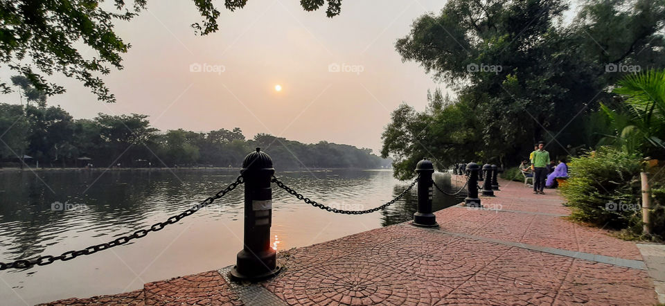A beautiful sceneric sunset view in the winter near a lake side.