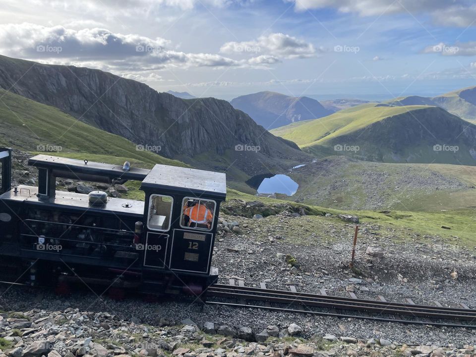 The train … chugging up Snowdon 