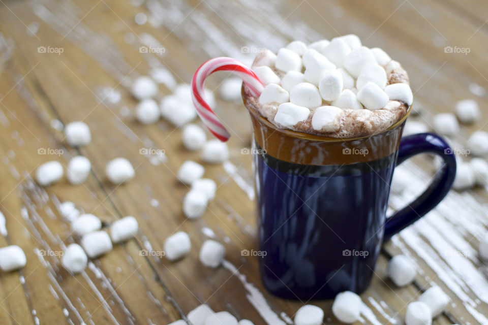 Close-up of coffee cup with candy cane