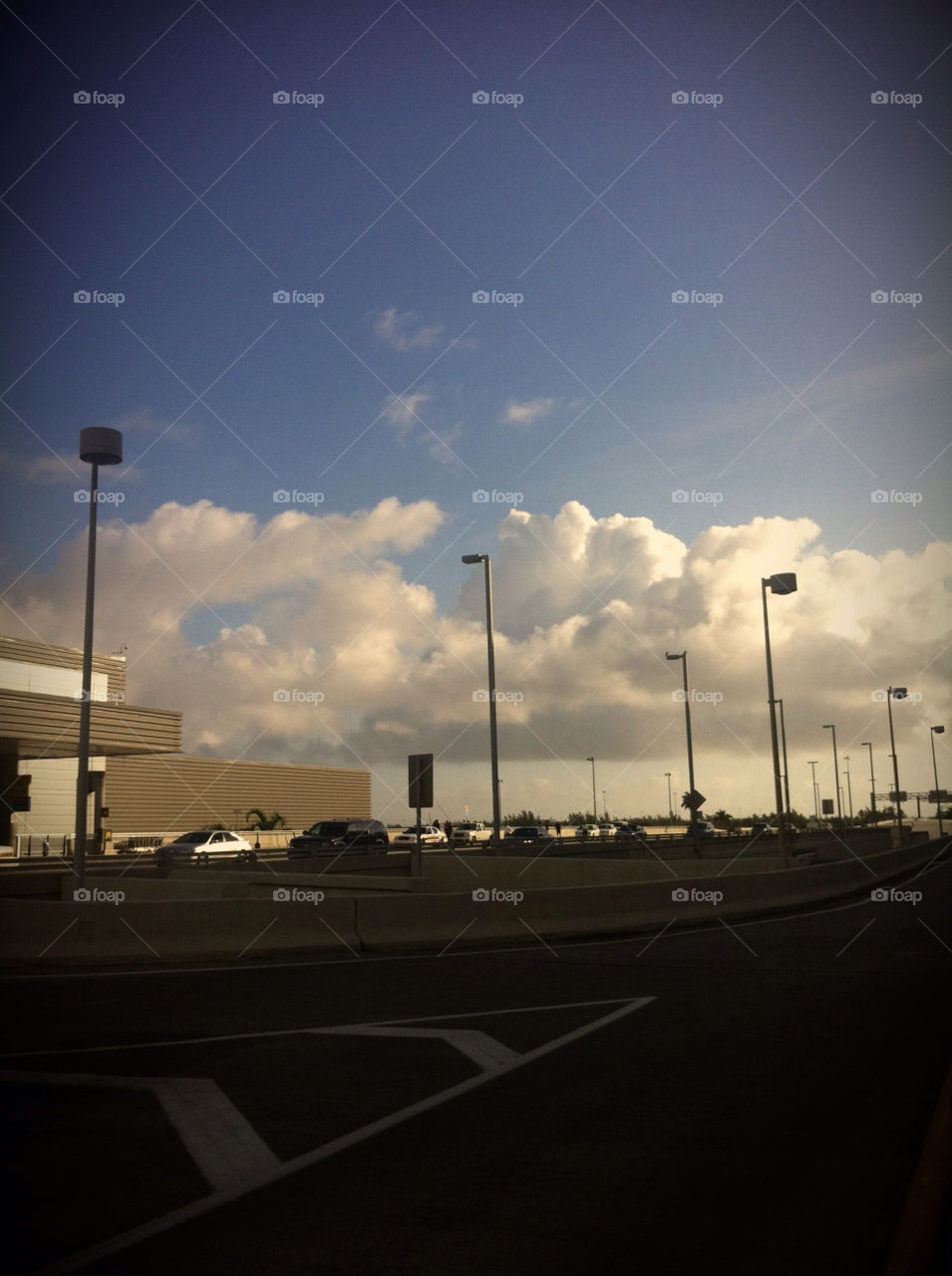 White puffy clouds against a blue sky.