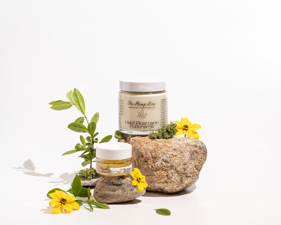 Two bottles of beauty products on a white background 