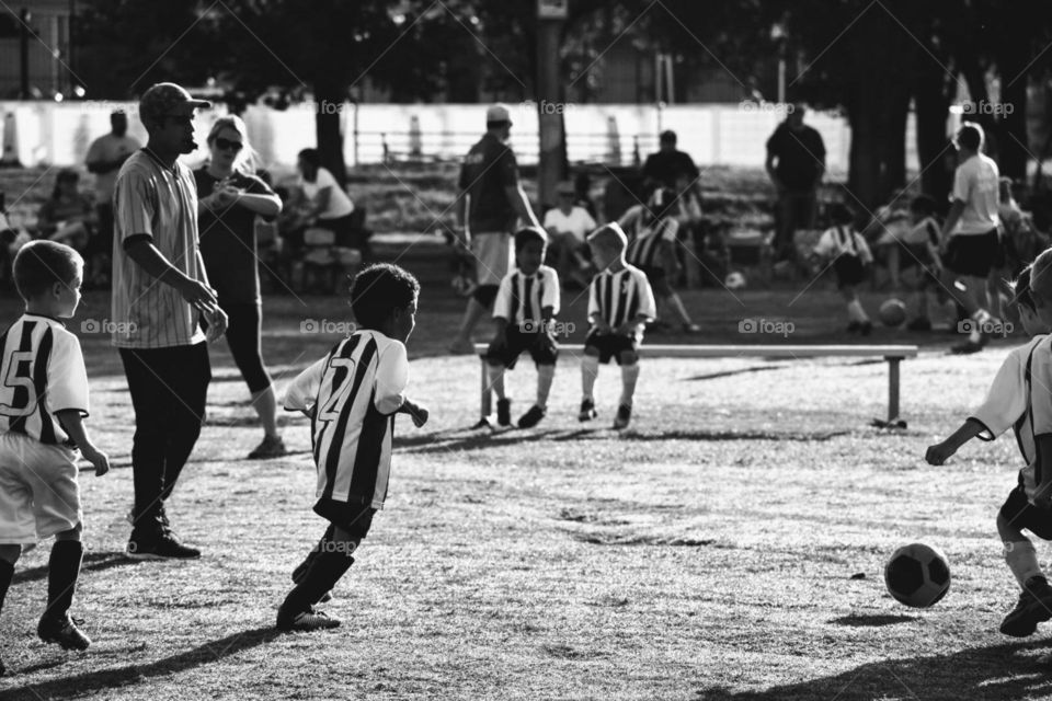 Summer is a good time to play soccer with friends. It is always a good time to spend with family as they cheer you on to a winning goal.