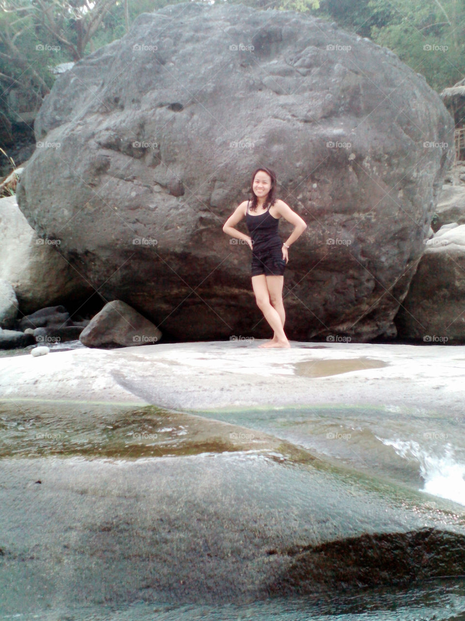 my beautiful girl standing at the big rock.