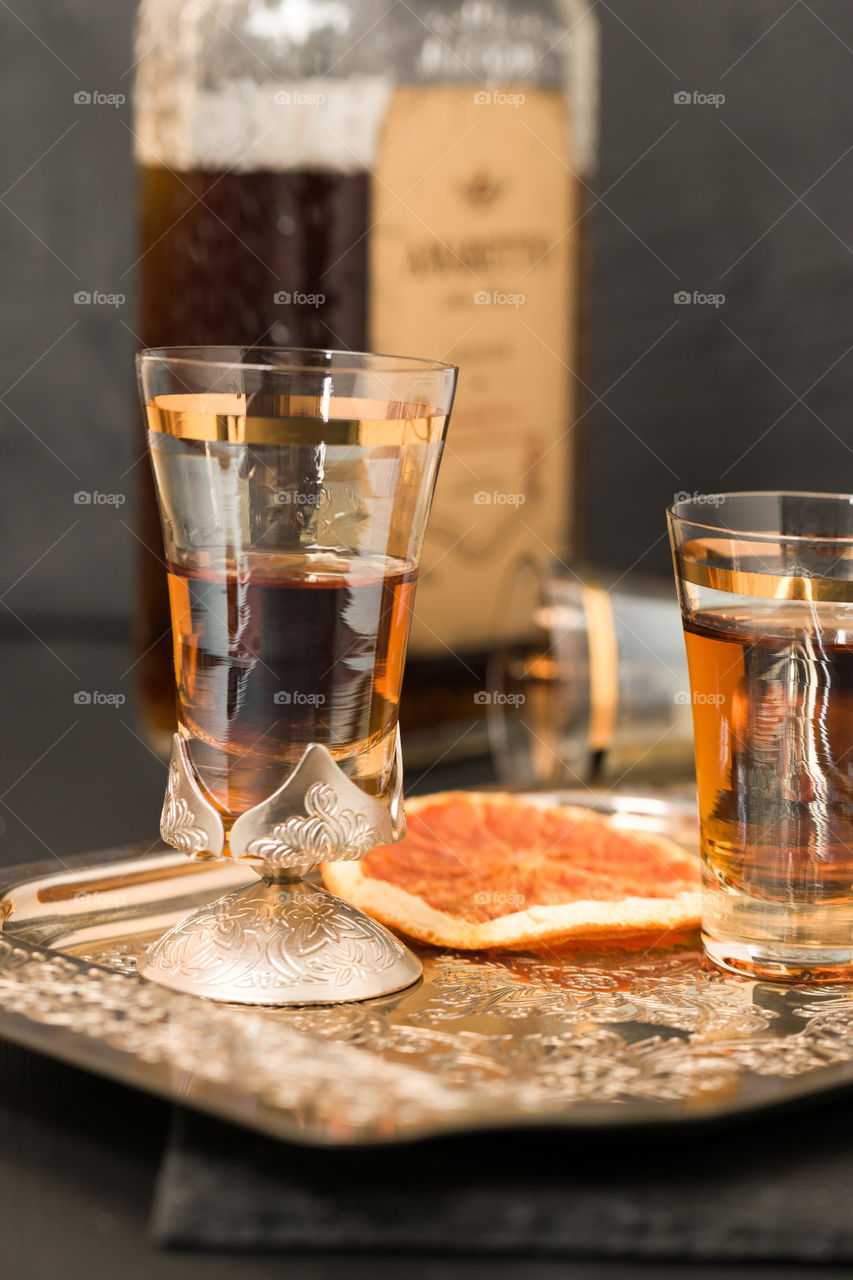 Amaretto liquor in antique glass shots