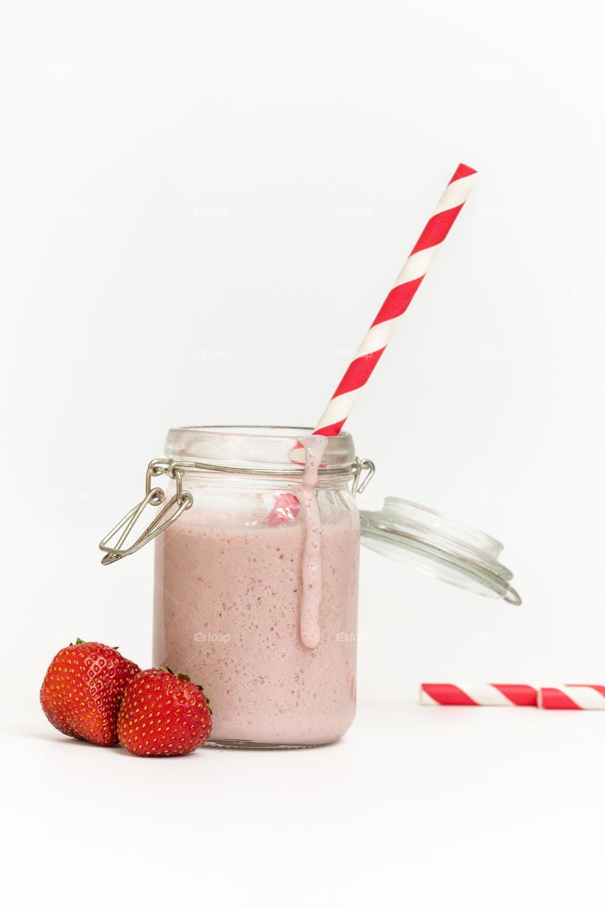 Studio photo of strawberry milkshake or smoothie