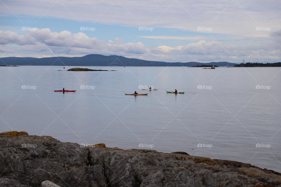 Four kayaks in the calm ocean 