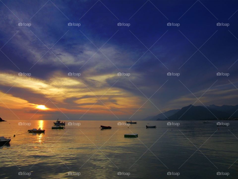 Sunset over Praia ( Italy ) with clouds.