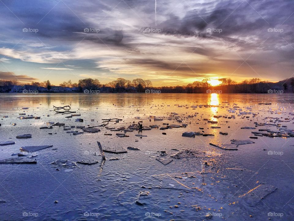 Sunset over an icy Spy Pond 