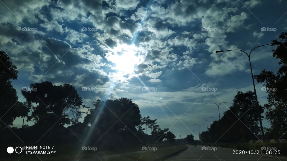 Sun Shining Through Cloud