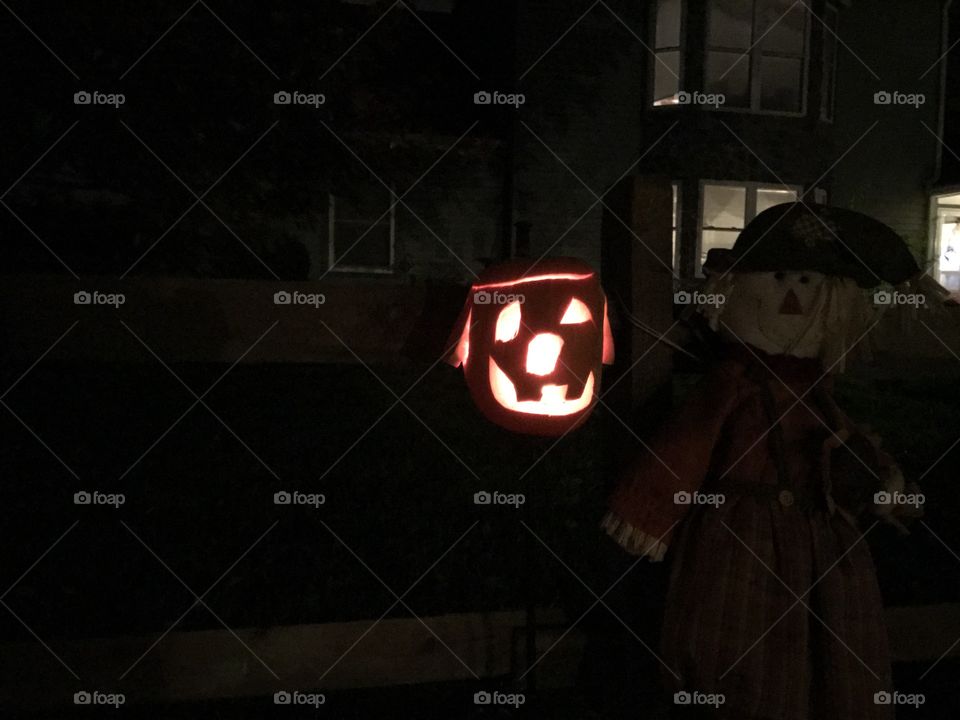 Goofy smiling pumpkin light up at night 