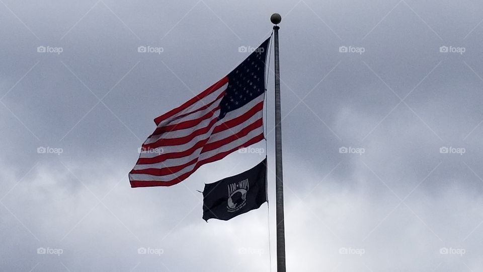 United States and POW flags