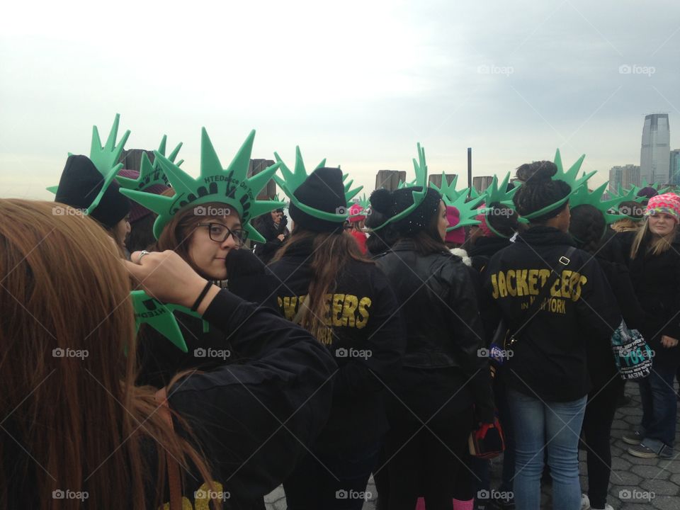 Statue of Liberty tourists. Students ready to visit The Statue of Liberty