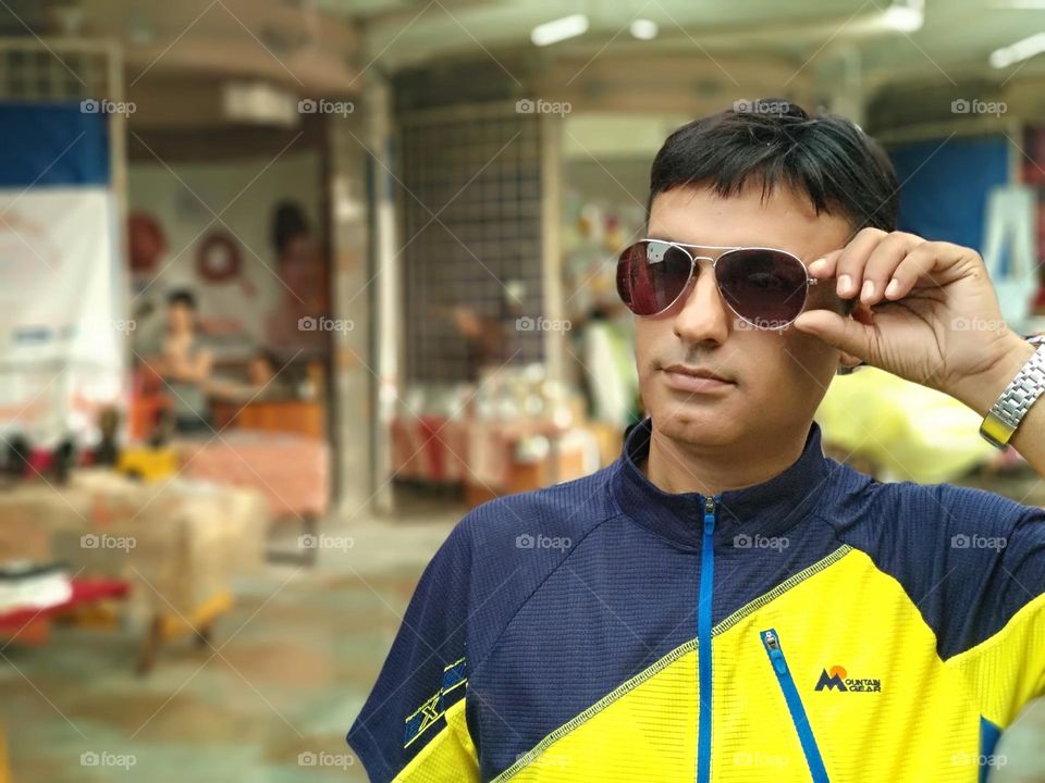 Indian man outdoors wearing sunglasses