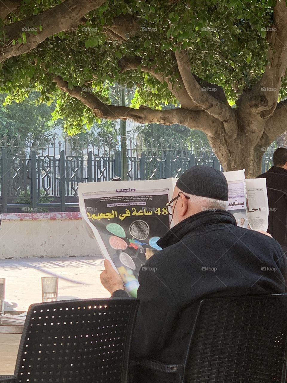 Old man read newspaper 