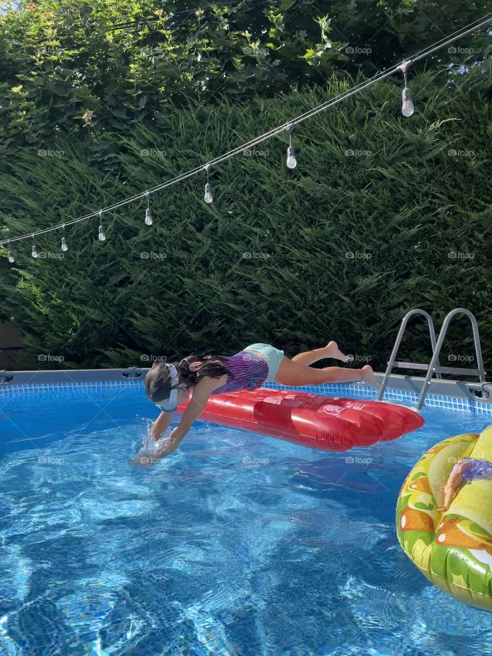 Jumping into swimming pool