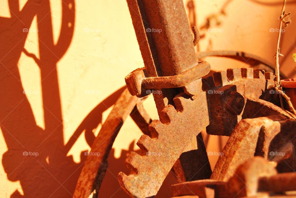 Detail of an old plow as a rustic decorative object.