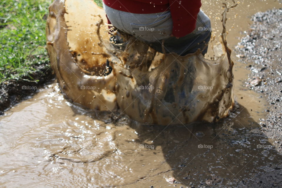 playing in puddles