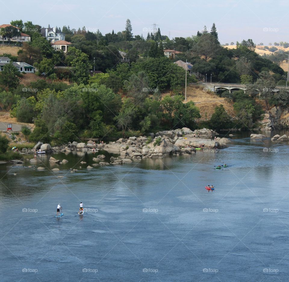 River play paddle boarding