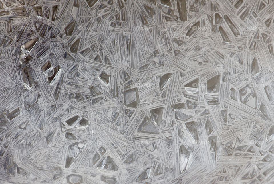 Frozen abstract forms of water in mountain stream