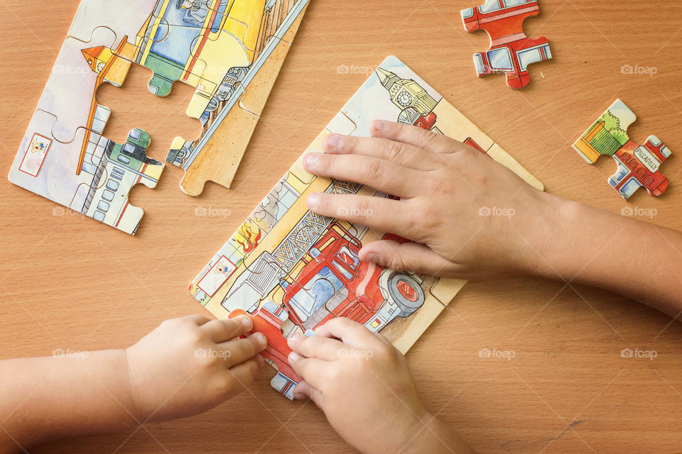 Children playing puzzle together