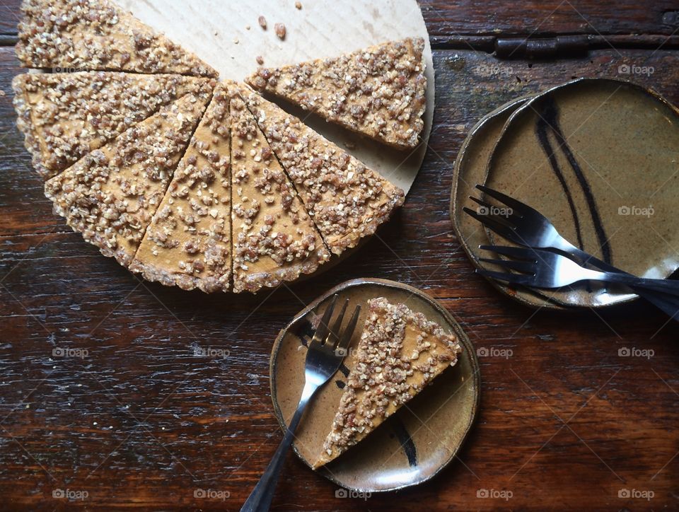 Pumpkin pie with crumb topping and plates