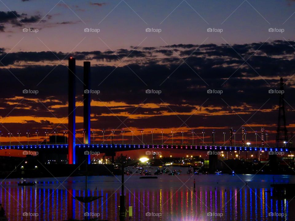 Bridge lights reflecting on the water