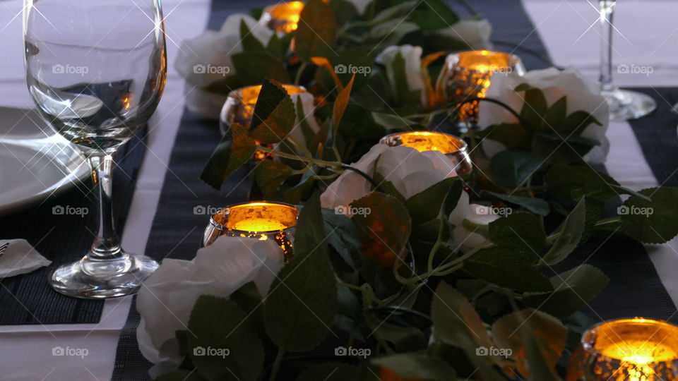 Candlelit dining table ready for a romantic sparkly dinner