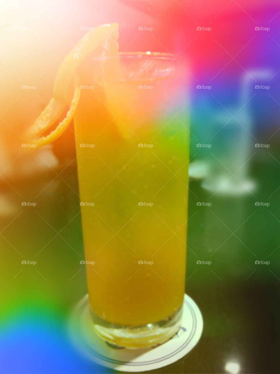 orange juice with lens flare