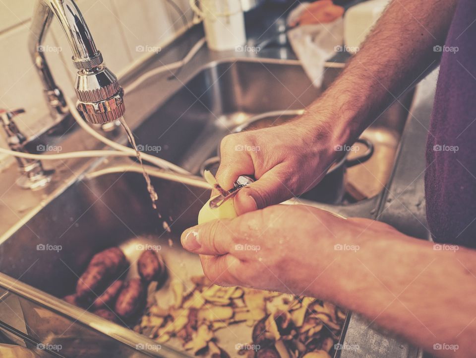 Peeling the potatoes.