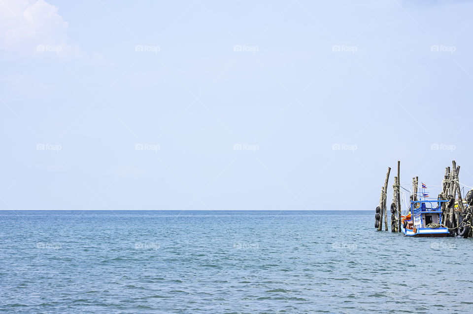 Fishing boats parked in the summer sea  at Koh Kood, Trat in Thailand.