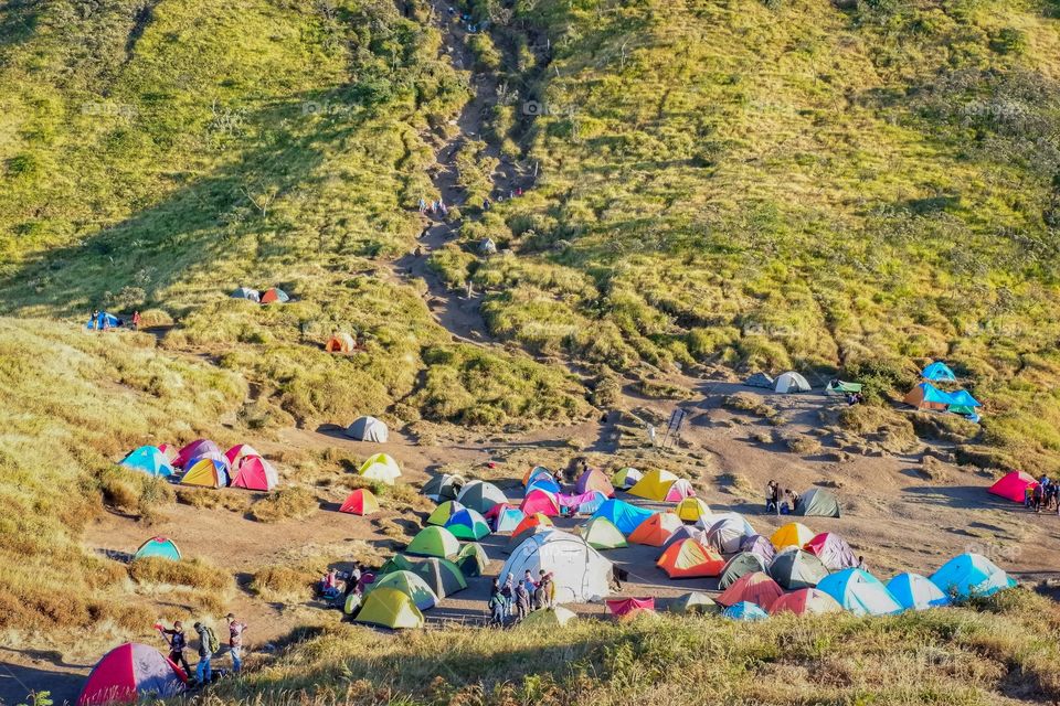 Backpackers camping at base of mountain at Indonesia 