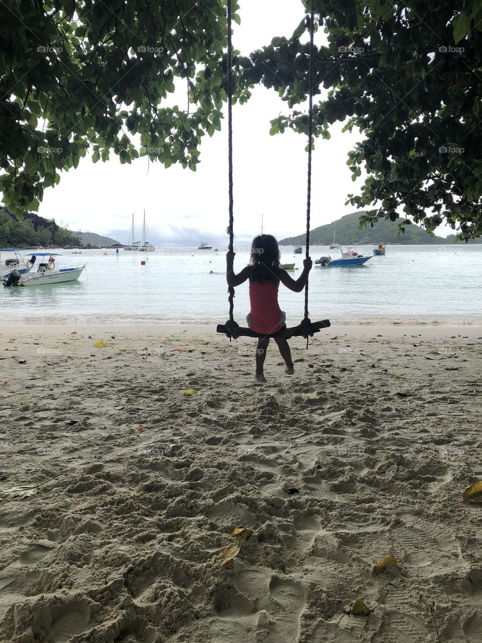 Girl on swing Port Launay Beach