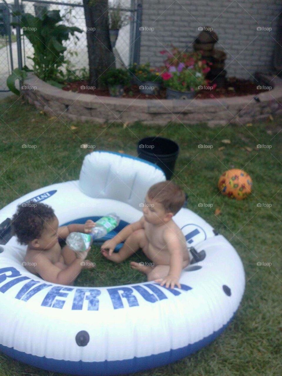 too cute. my son and nephew playing out the pool