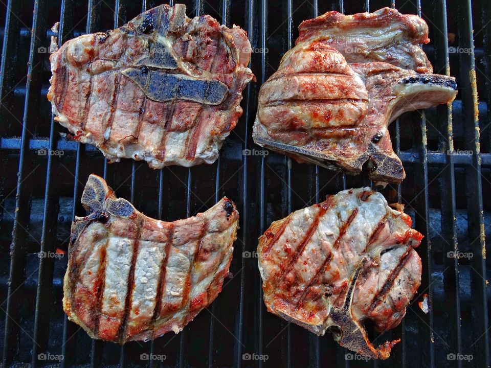 Grilling Pork Chops. Pork Chops Grilling On The Barbecue
