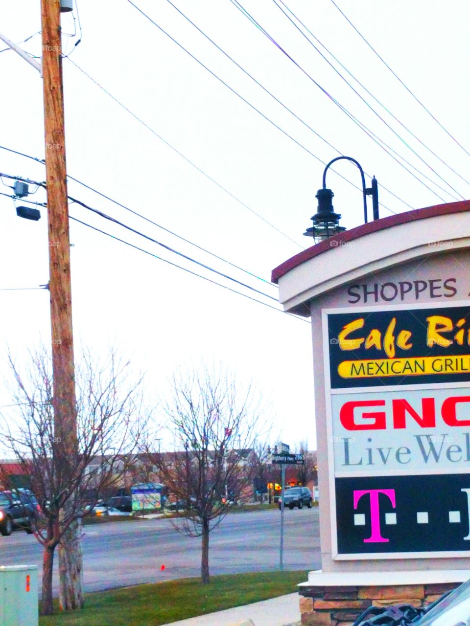 Store Sign, Street, and Power Lines