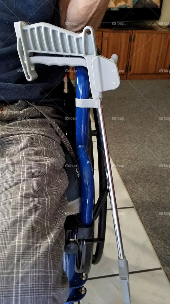 Reachers attached to the wheelchair