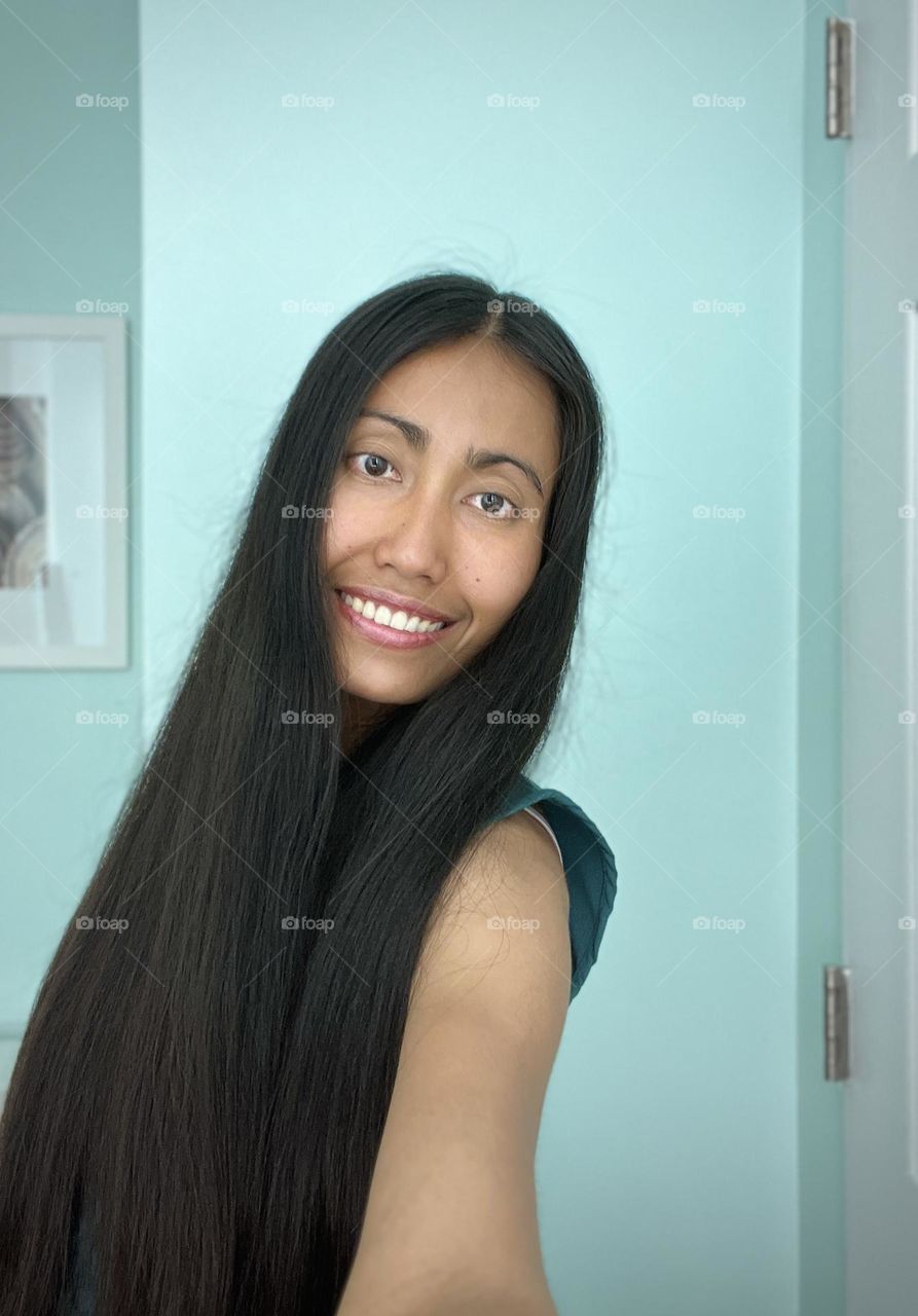 Smiling woman with long black hair 