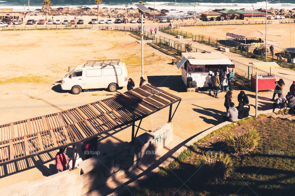 People buying some fast food at the streets of El Tabo