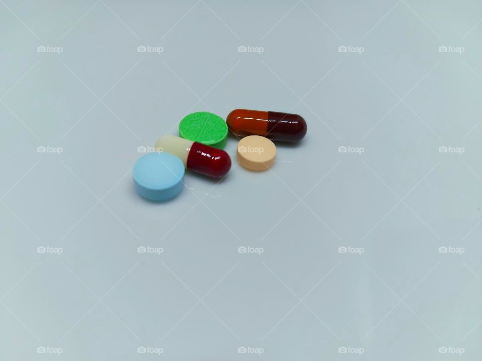 Medicines with variant shapes, colors on a white background, Drugs