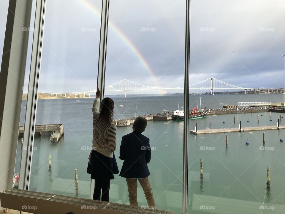 Boy & Girl looking at rainbow