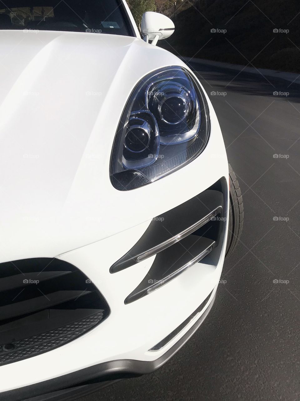 Grill and headlamp details of a Porsche automobile