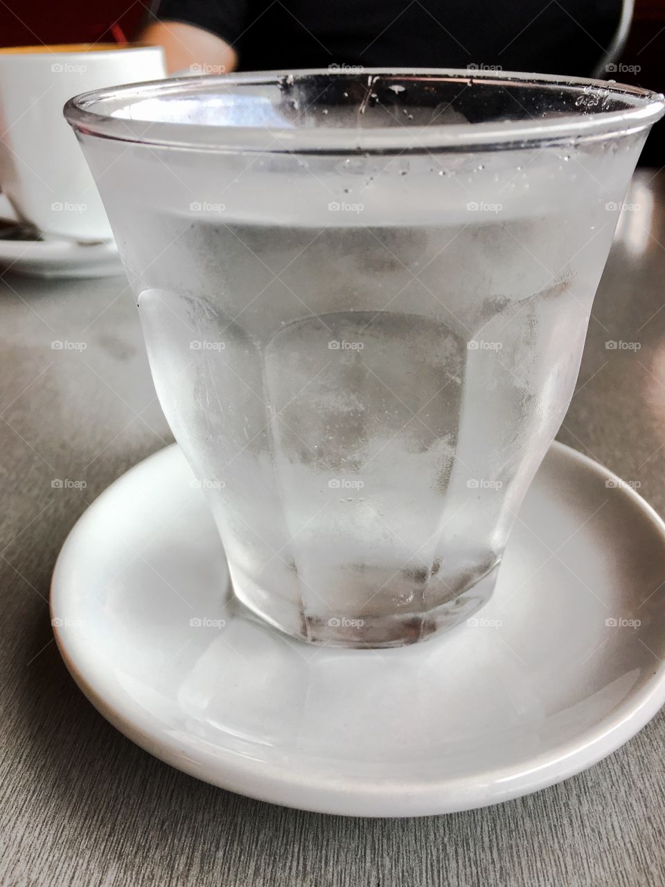 One clear glass of fresh ice cold water  closeup 