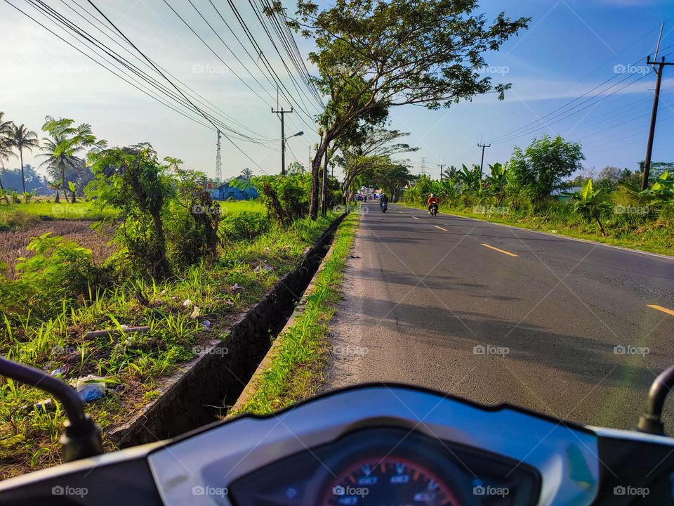Take a trip on a motorbike when the sun is shining and the sky is blue
