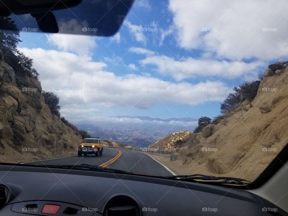 Mazda 2 interior on a roadtrip through mountain pass.