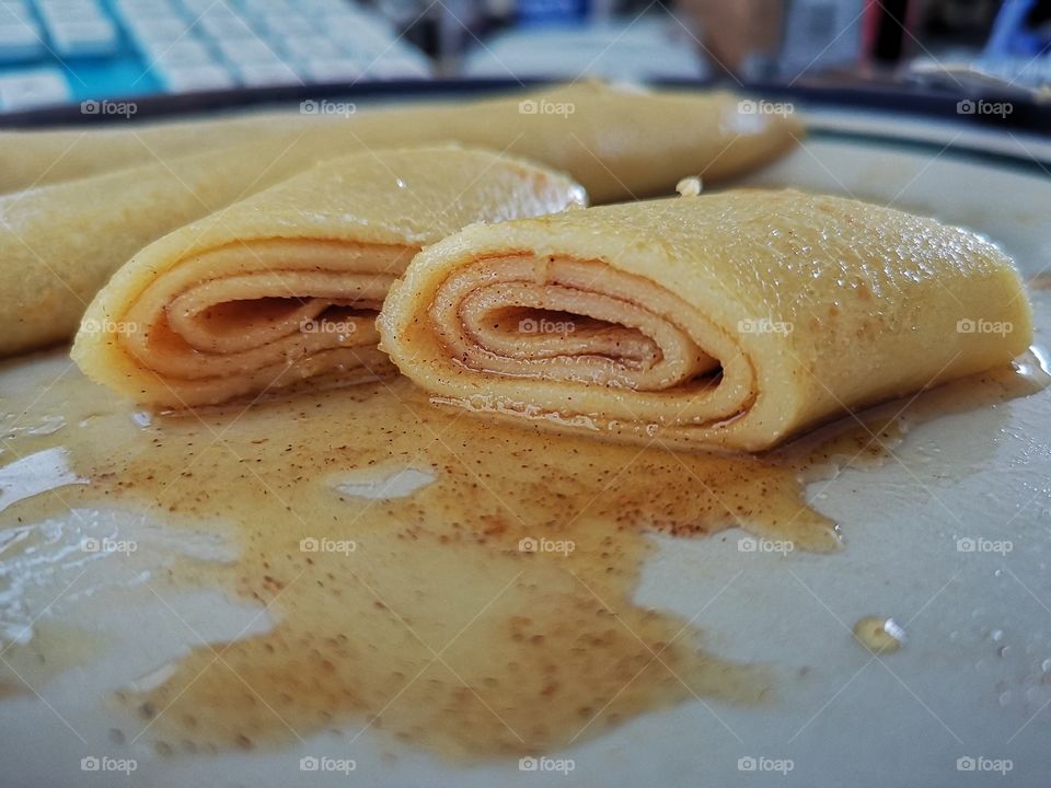Crepes with butter, golden syrup and cinammon sugar