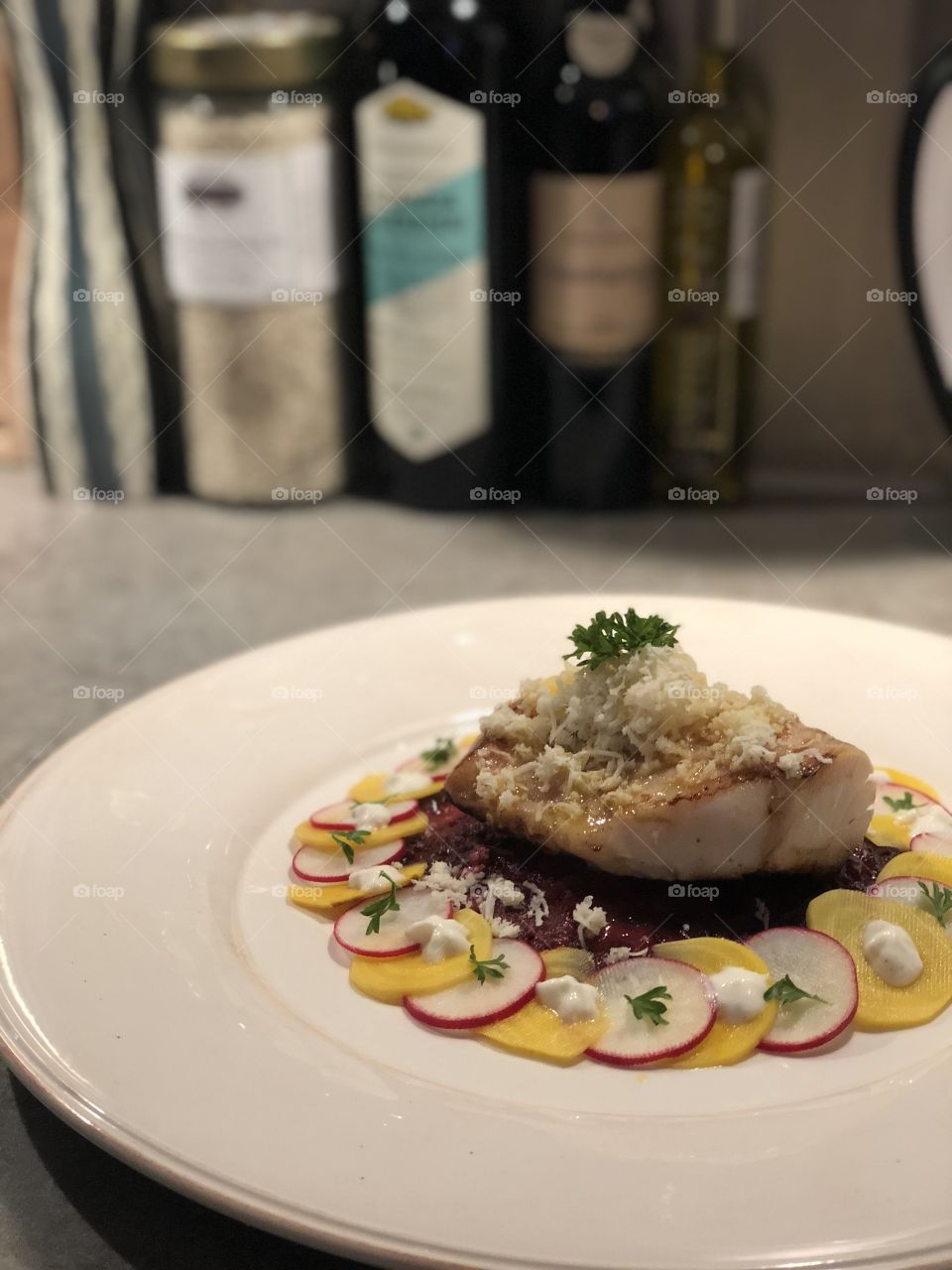 Amazing cod served with hash brownie made of beets and some pickled radish topped with horseradish