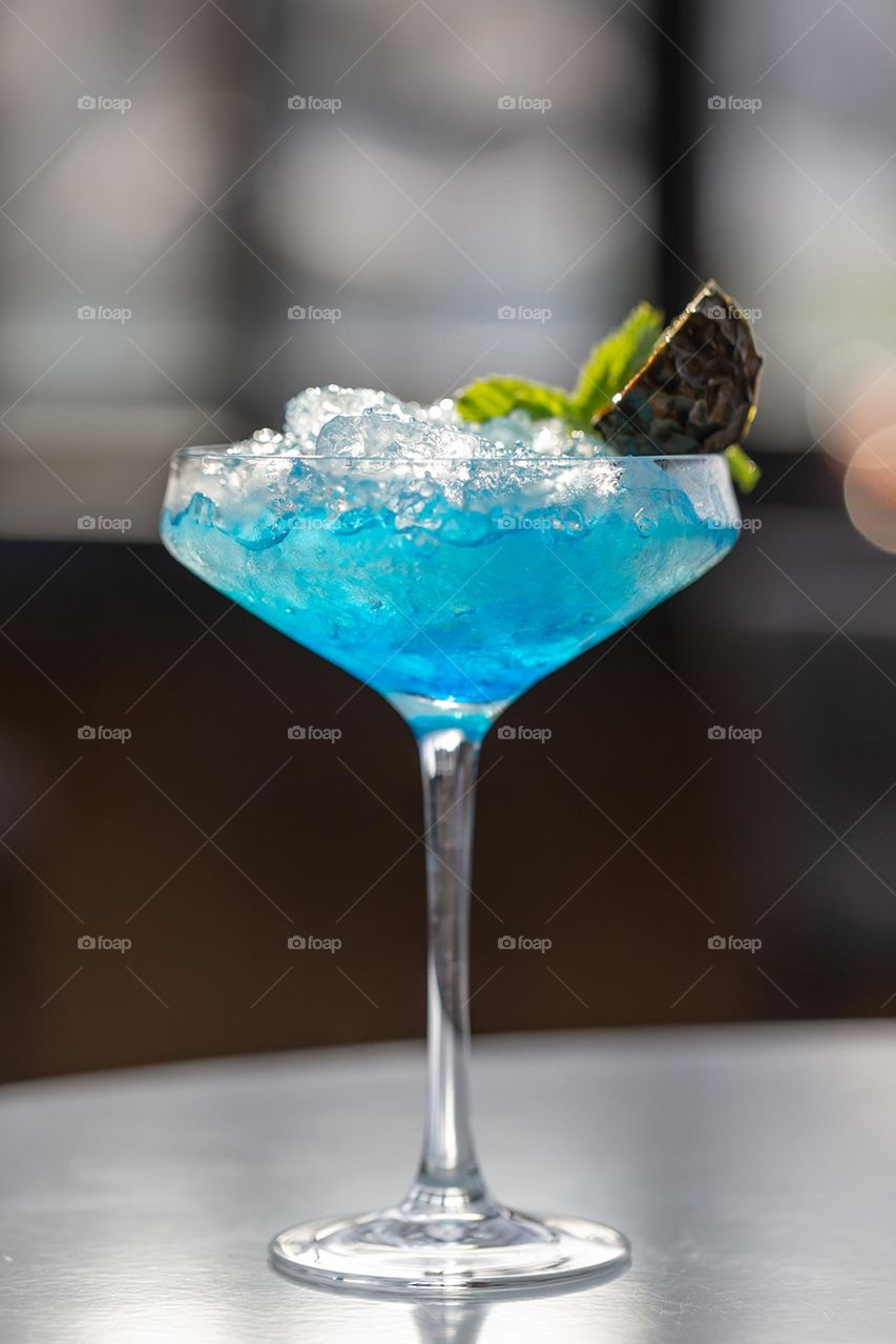 Colorful blue cocktail at the bar