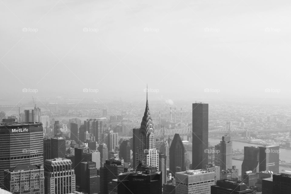 Black and white photo of New York skyline from the air. 