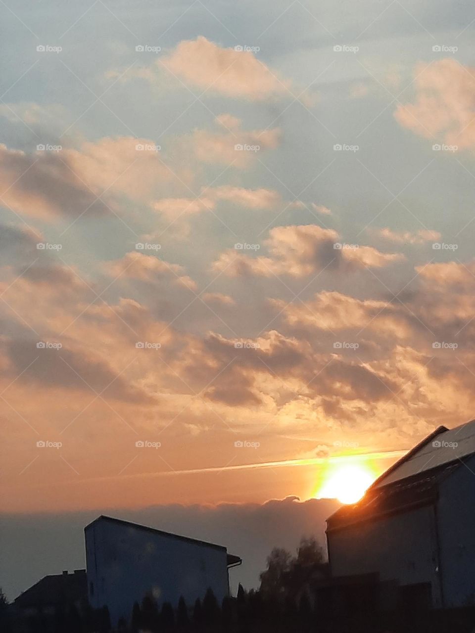 yellow sky with dark clouds at sunrise